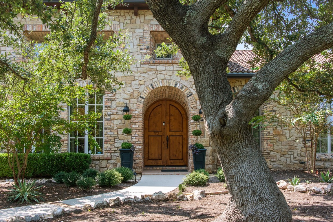 a front view of a house with garden