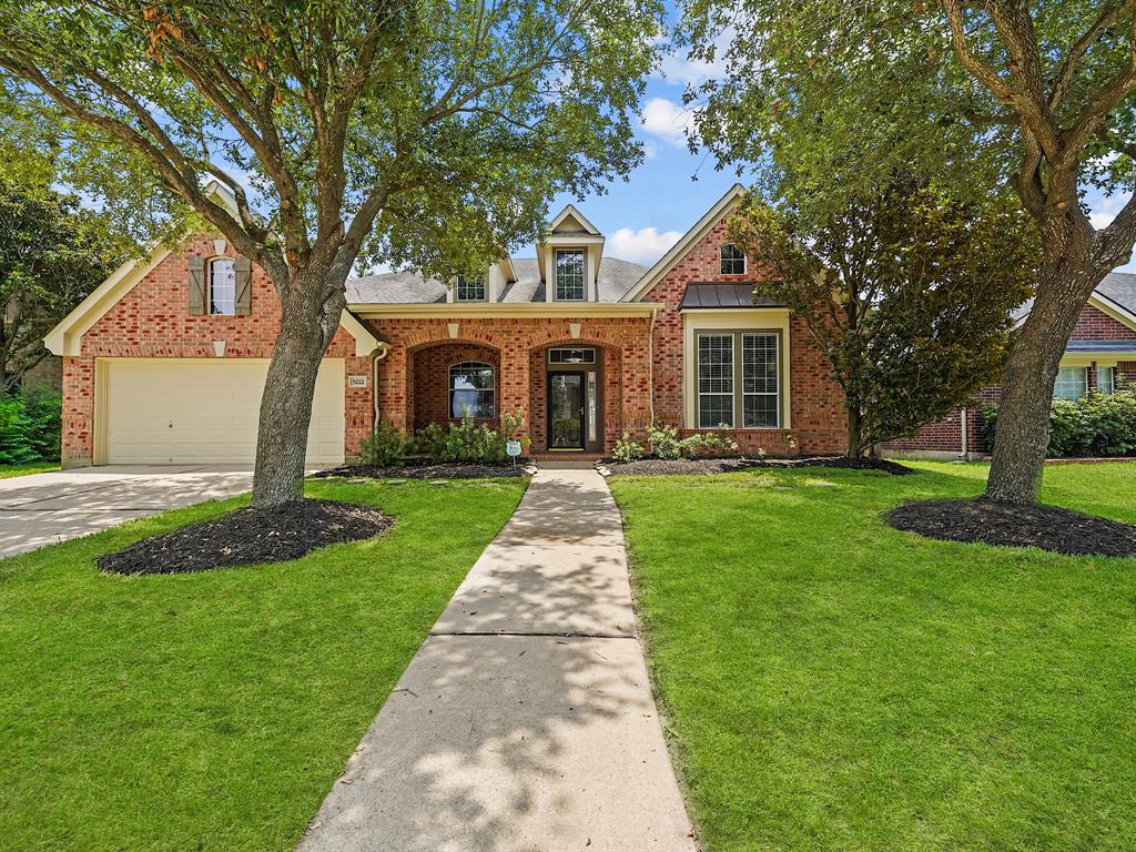 front view of a house and a yard