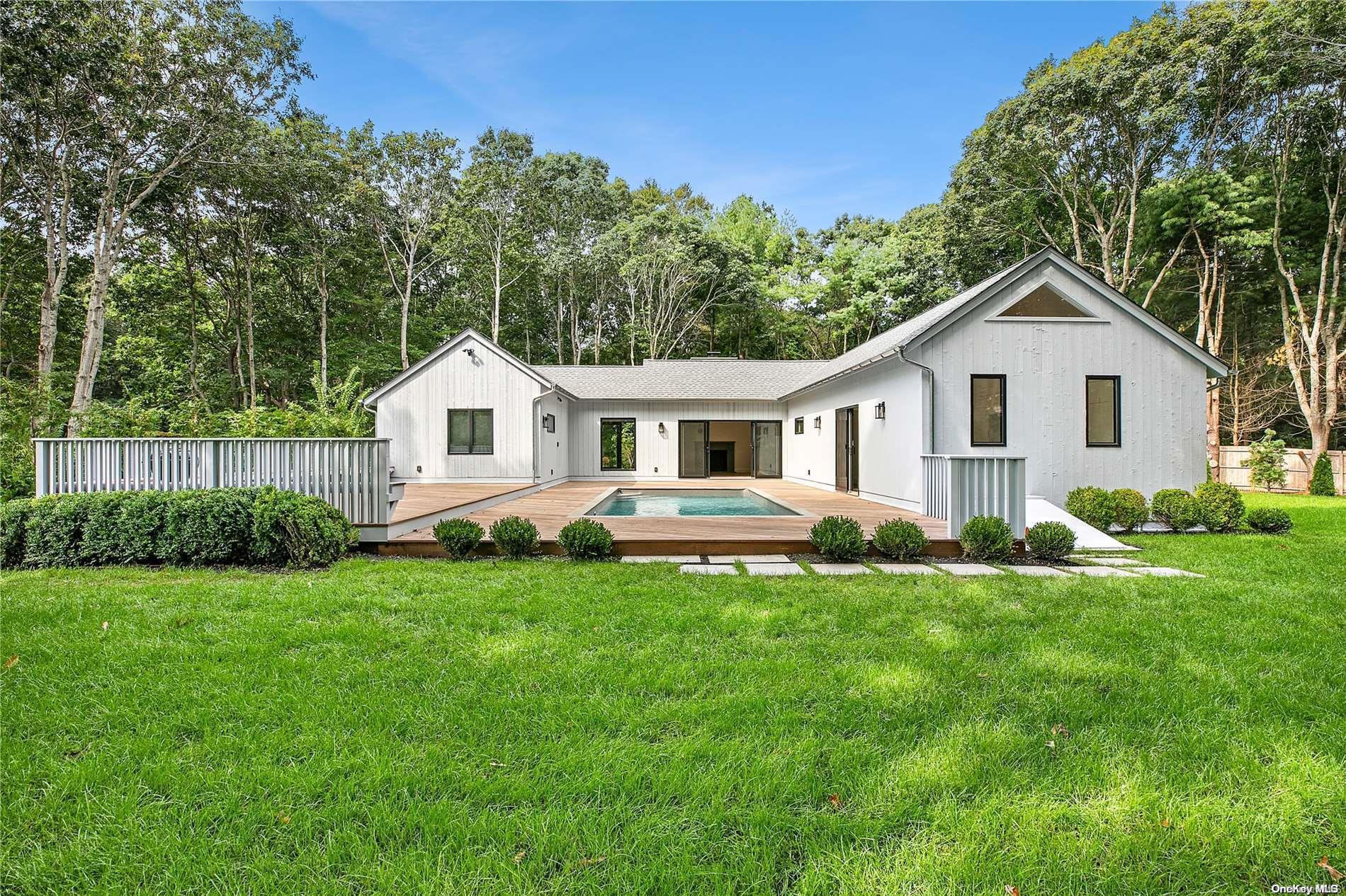 a view of a house and a yard with green space