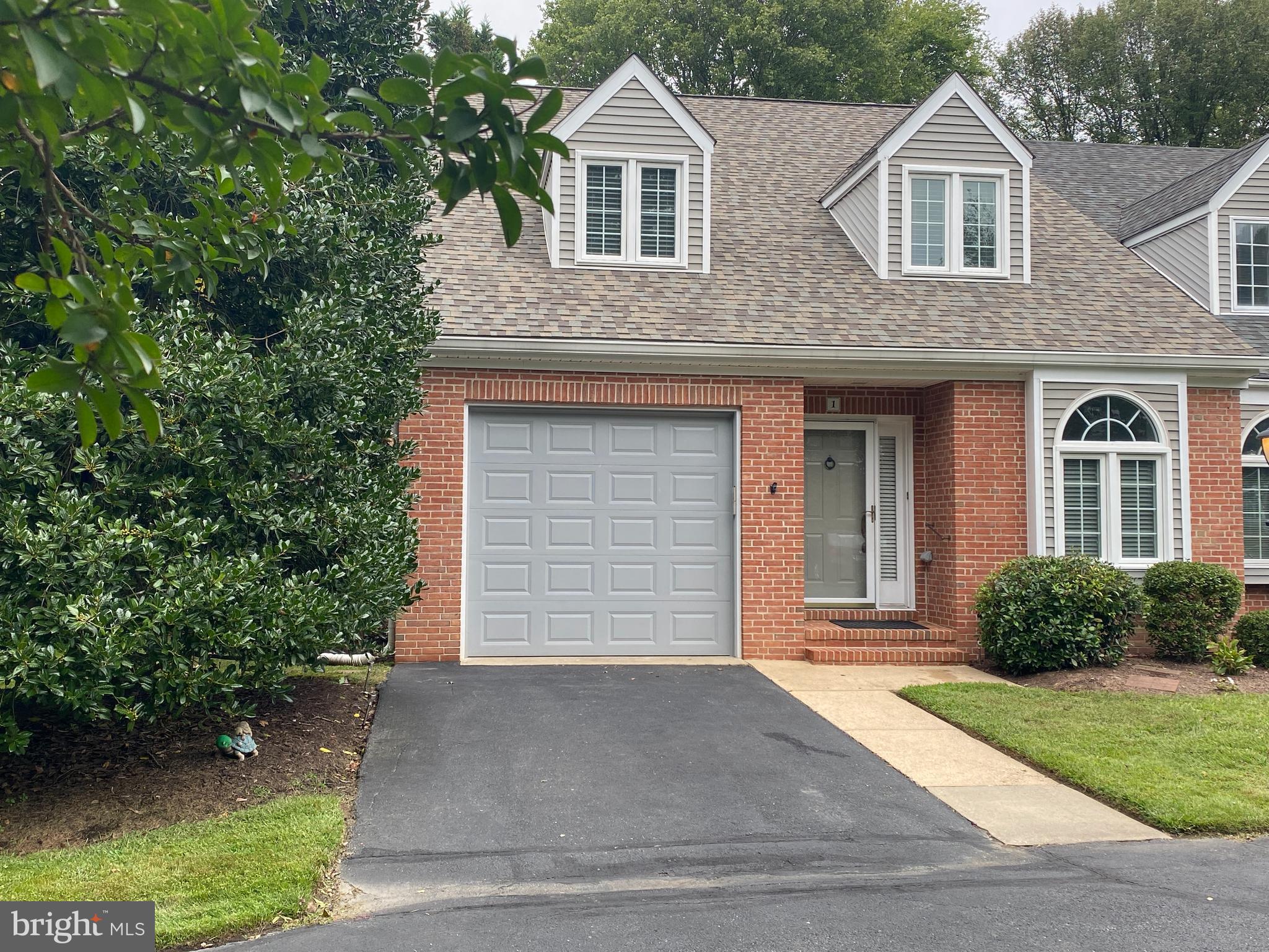 front view of a house and a yard