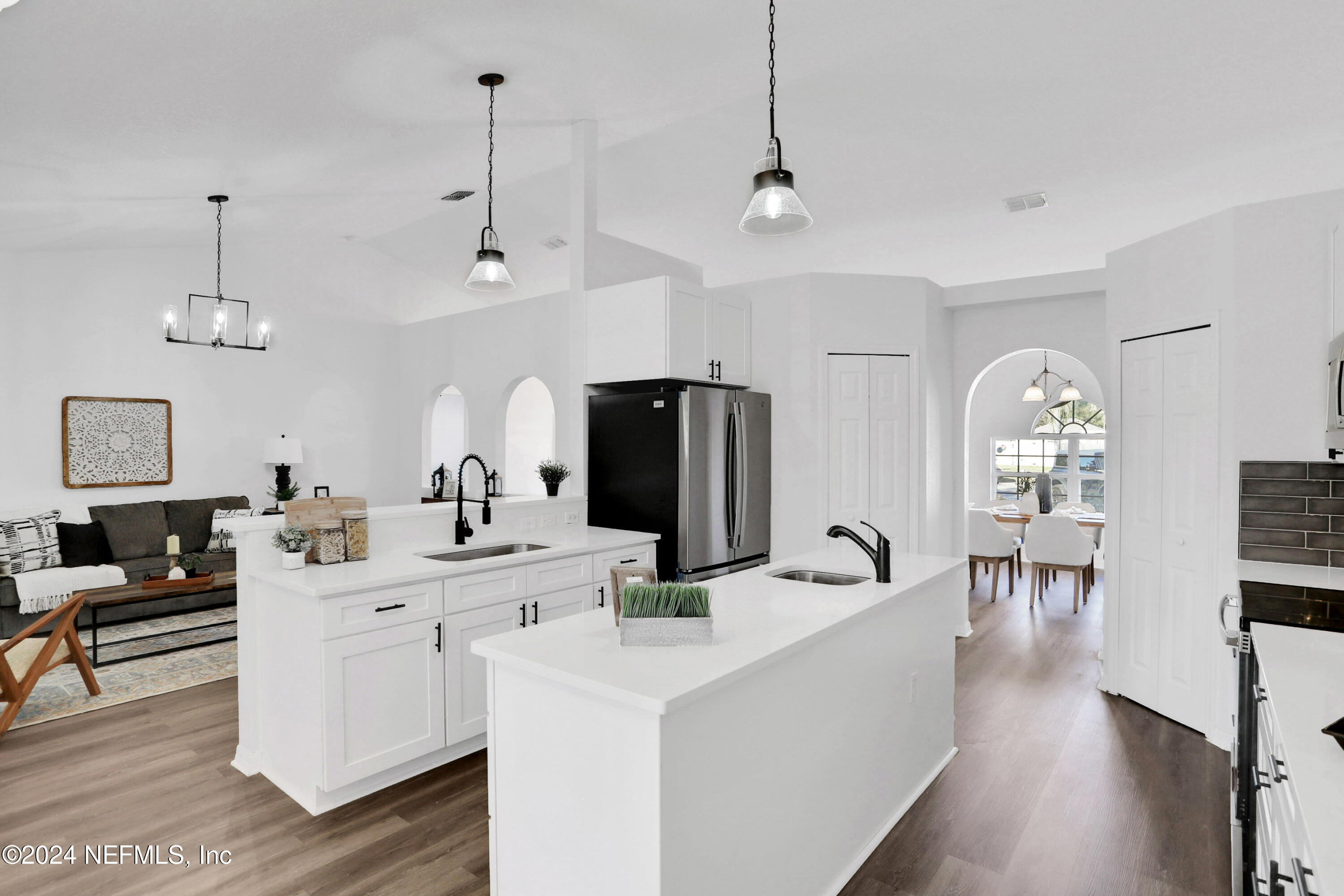 a very nice looking dining room with wooden floor