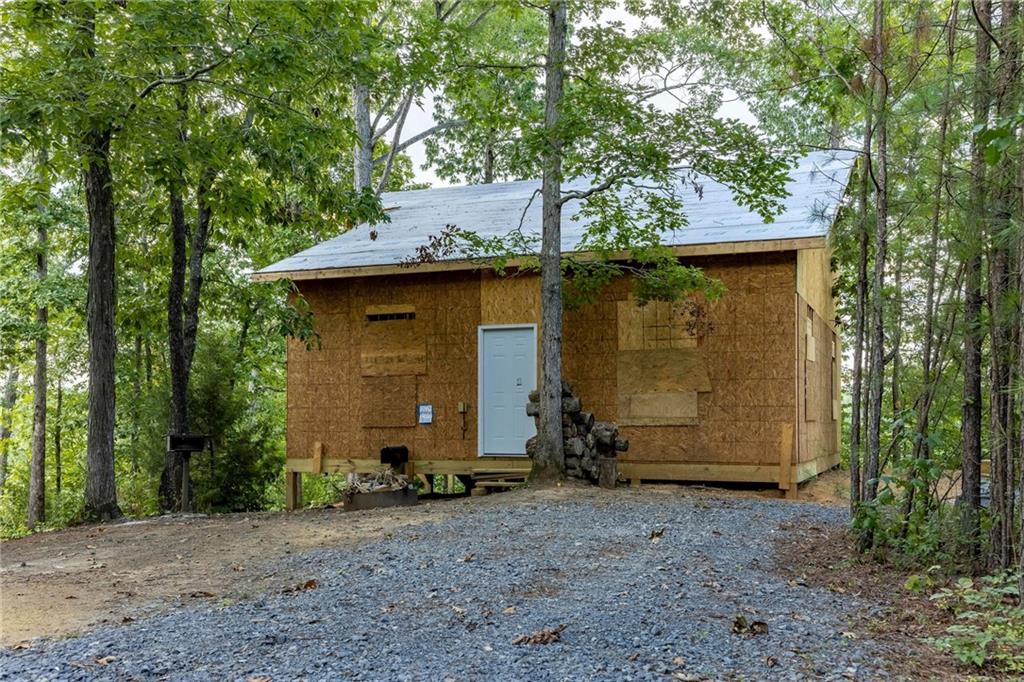 a view of a barn in the middle of a yard