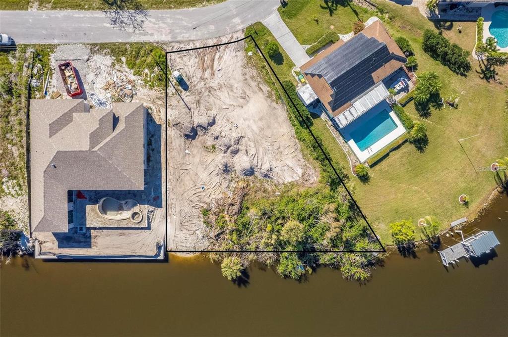 an aerial view of a house with a ocean view