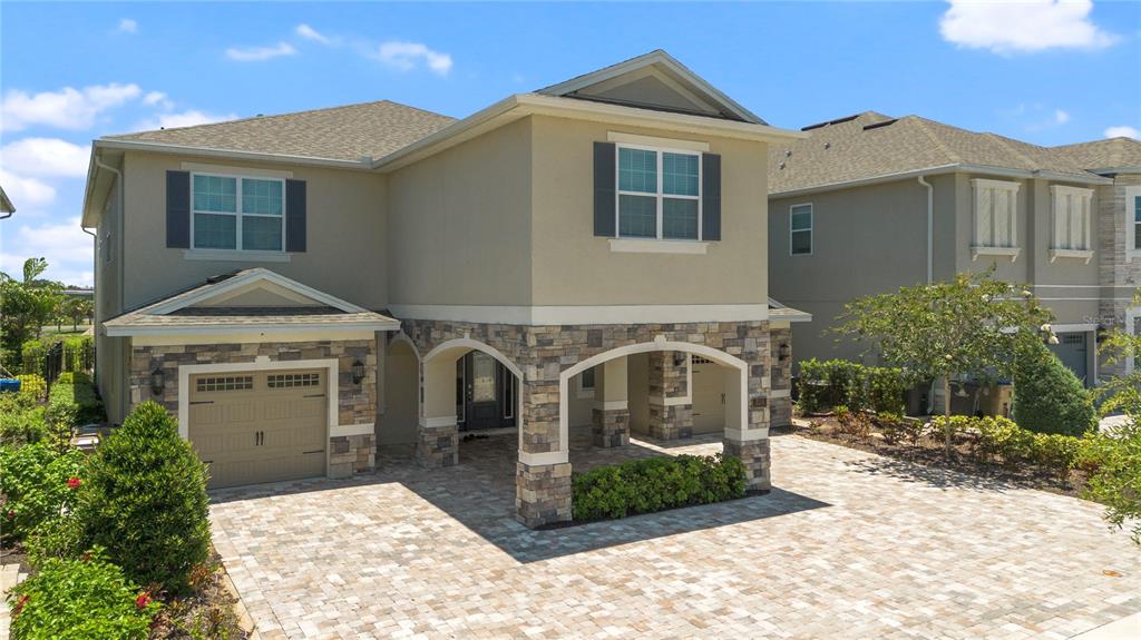 a front view of a house with garage