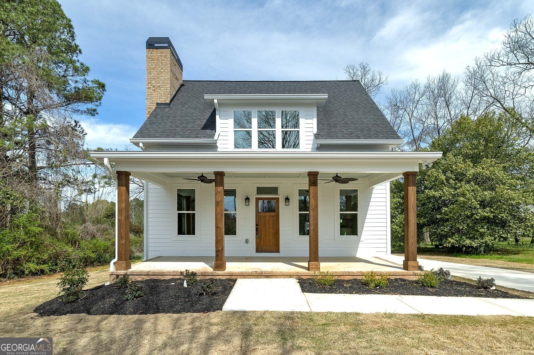 a front view of a house with a yard