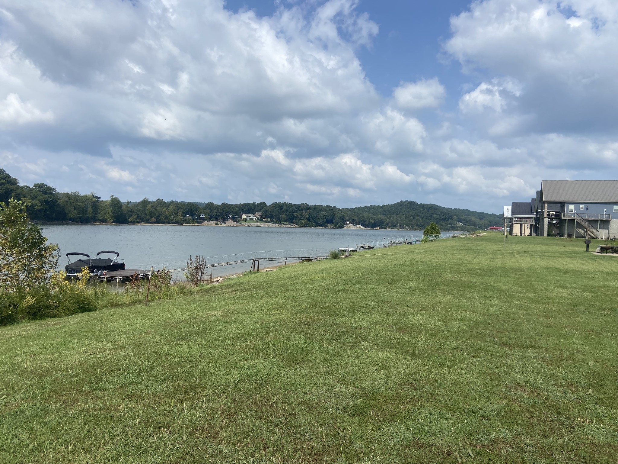 a view of a lake with houses in the back