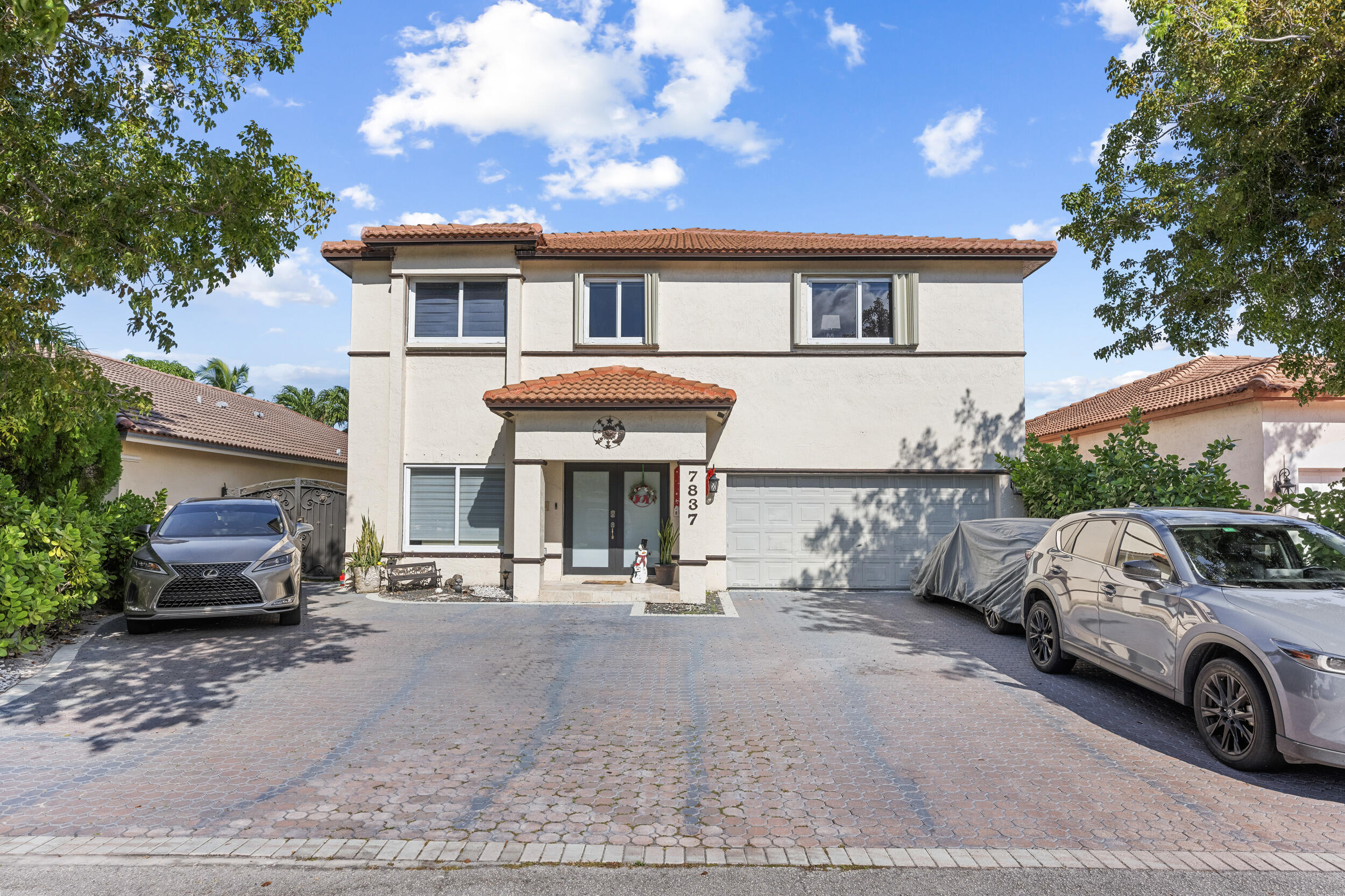 a view of a car park in front of house