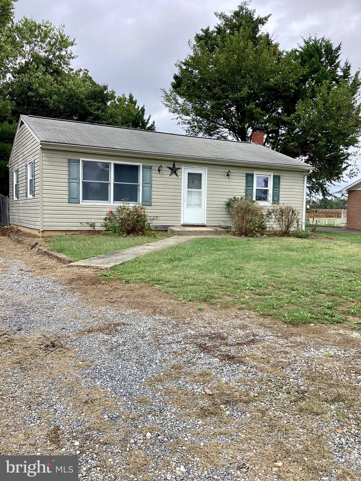 a view of a house with a backyard