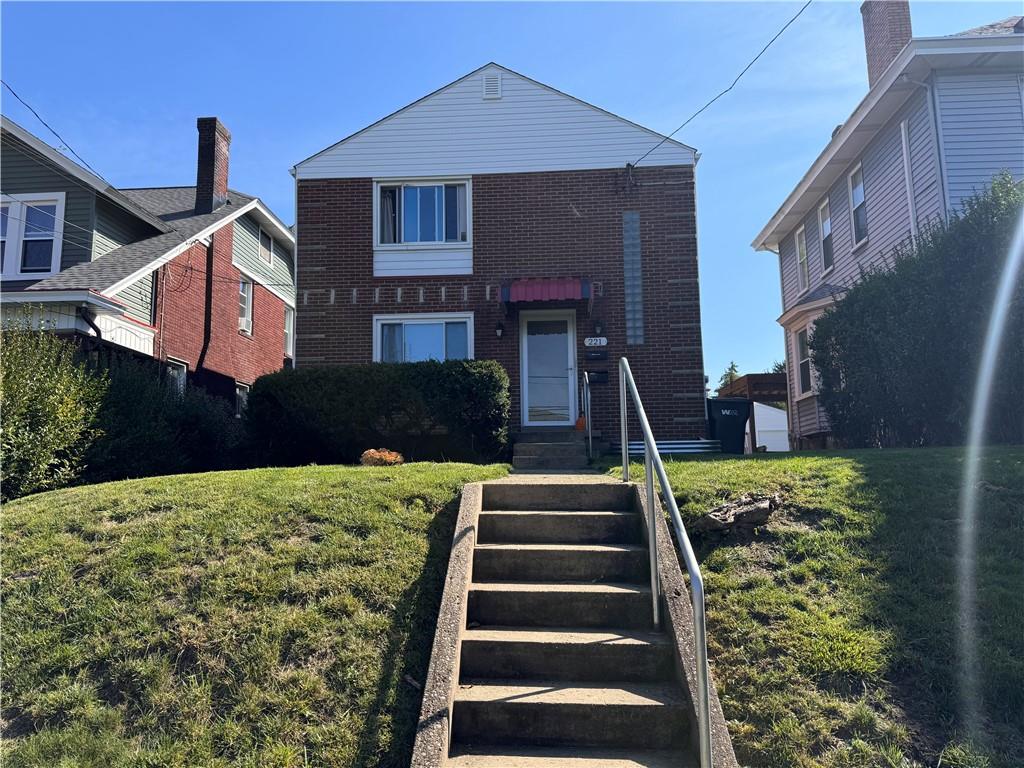 a front view of a house with a yard