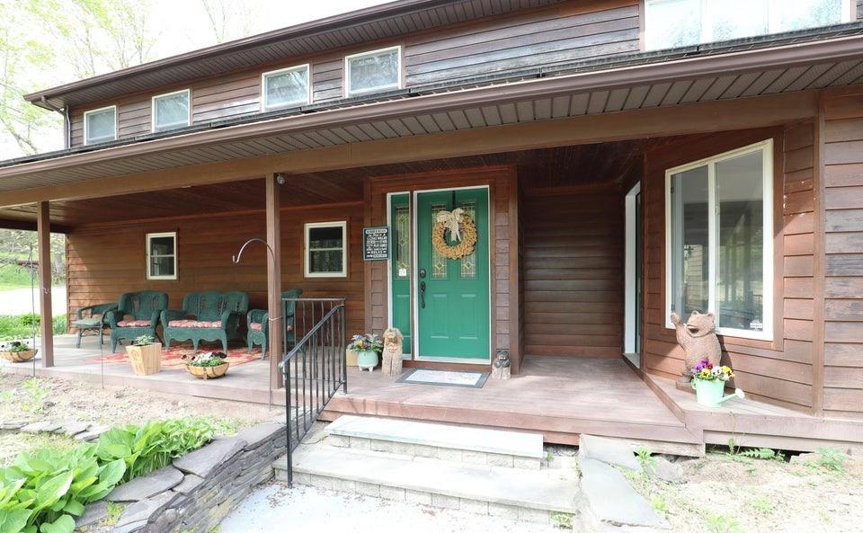 Property entrance featuring a porch