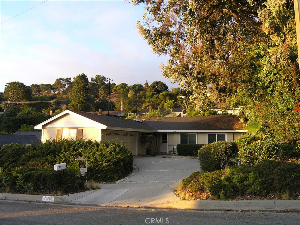 a view of house with outdoor space and sitting space