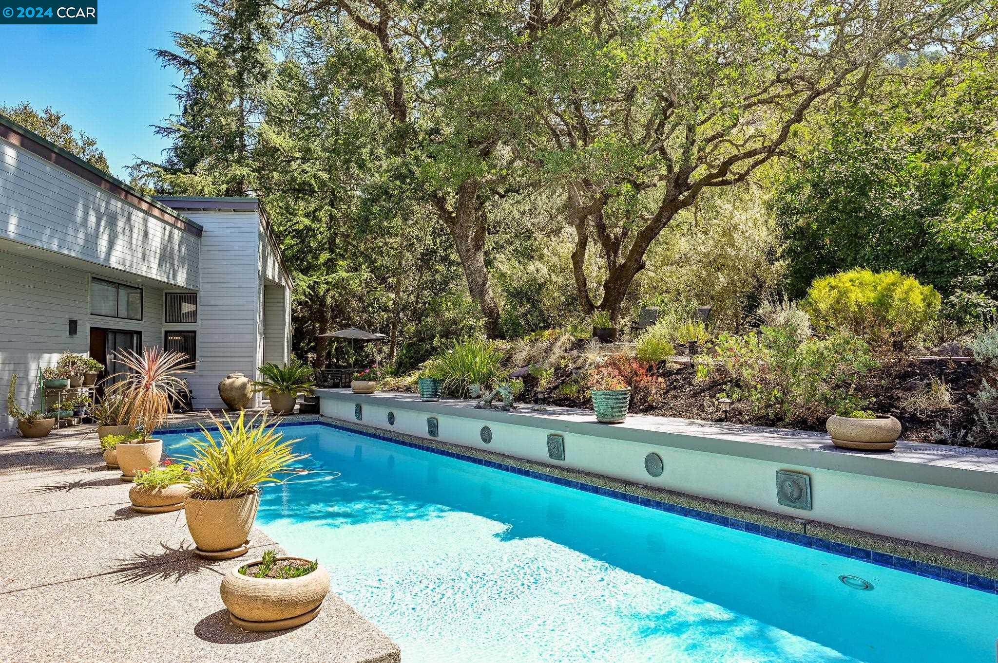 a view of swimming pool with a patio