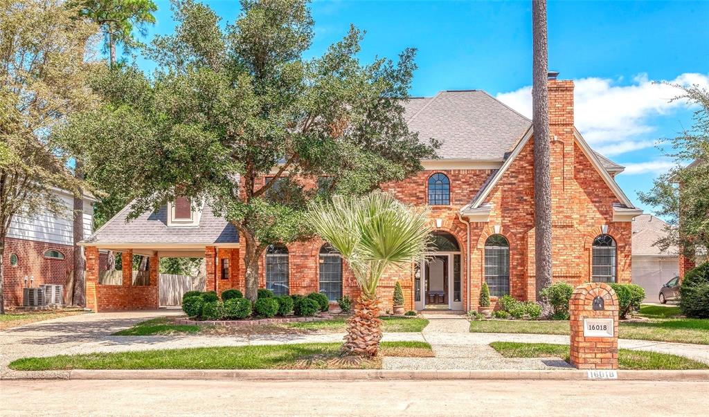 Charming English-style residence with an inviting landscaped front garden.