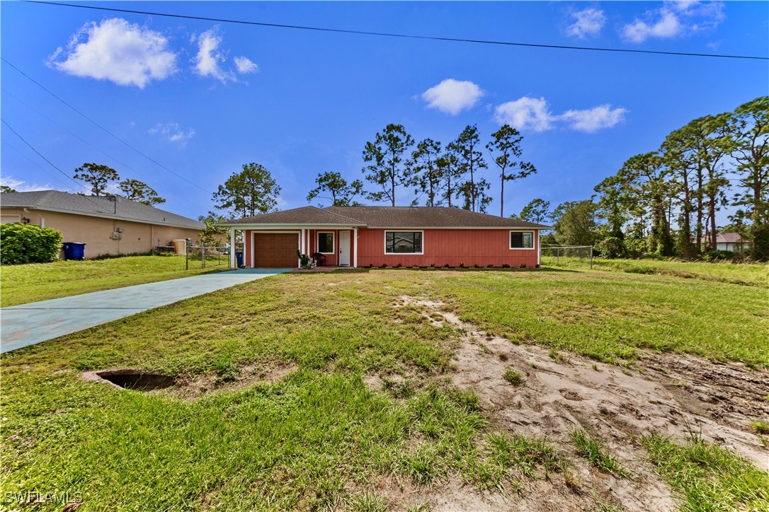 a view of a house with a big yard