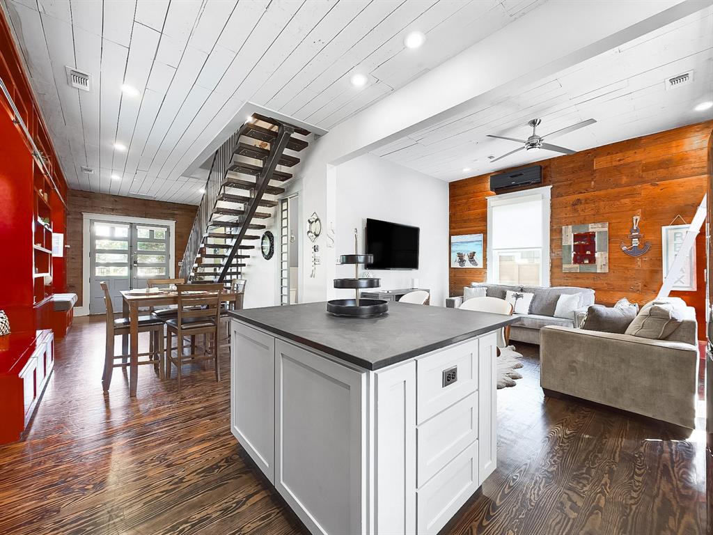 a kitchen with stainless steel appliances granite countertop a stove and a refrigerator