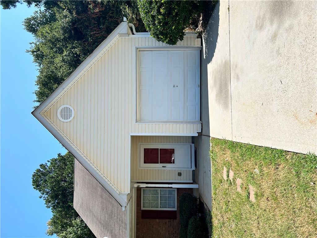 a house with yard in front of it