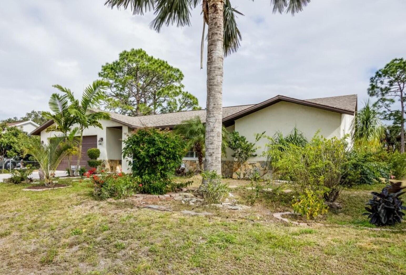 a house with a tree in front of it