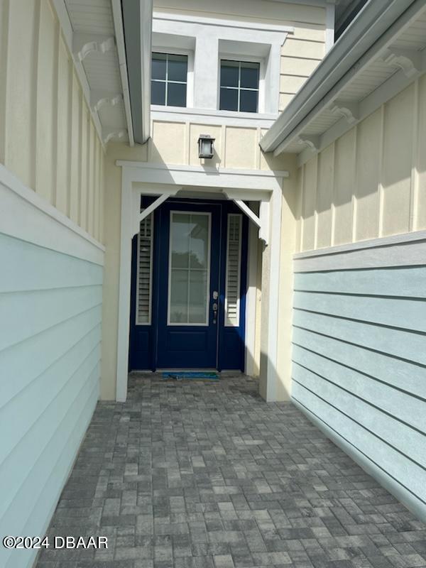 a view of front door and a garage