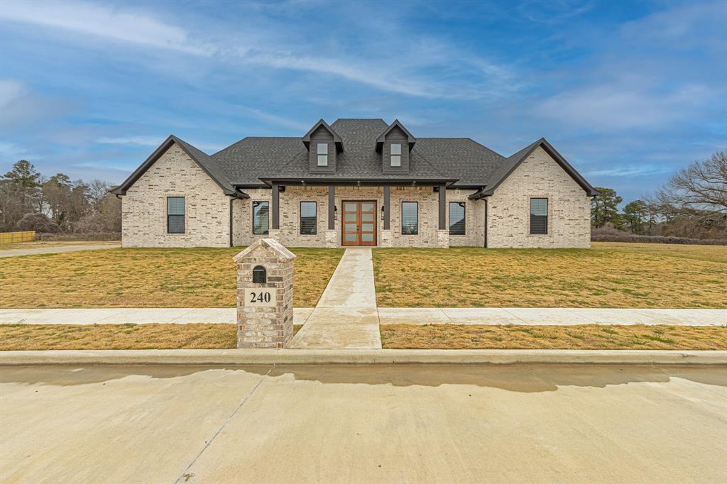 a front view of a house with a ocean view