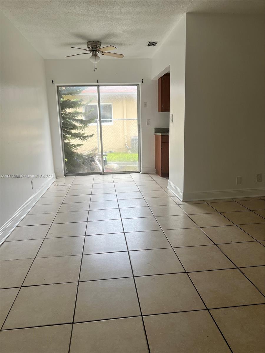 a view of an empty room and window