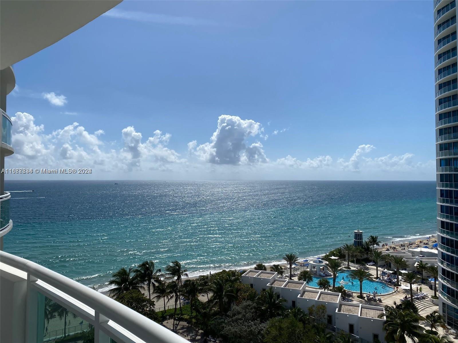 a view of a lake from a balcony