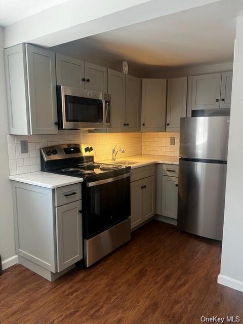 a kitchen with stainless steel appliances a refrigerator stove and sink
