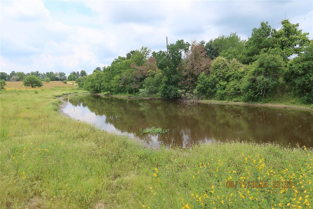 a view of a lake with houses in the back