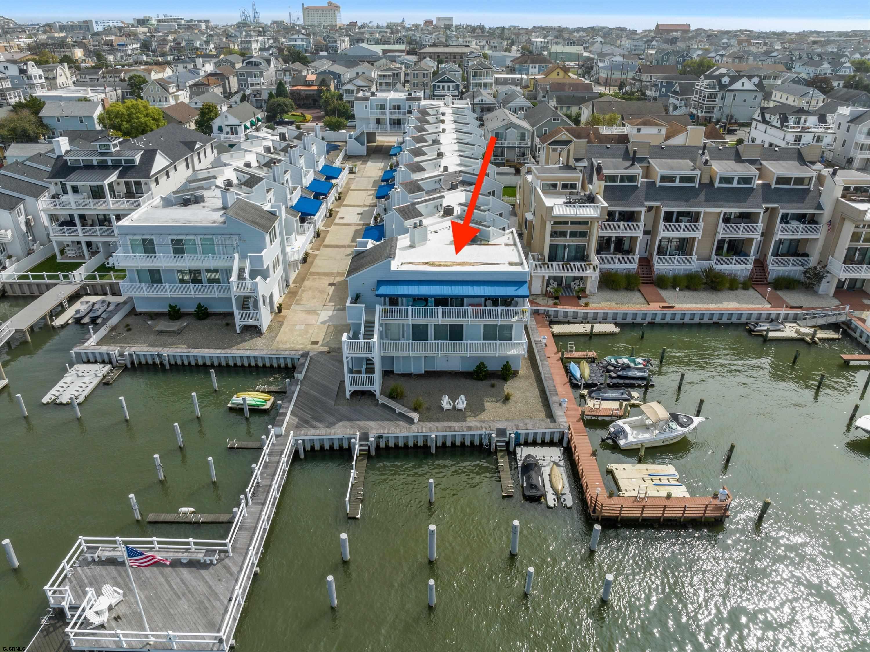 an aerial view of a house with a lake view