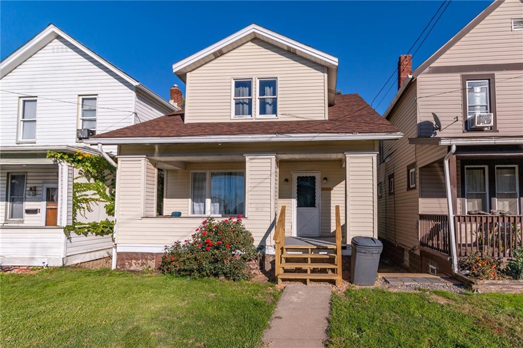 front view of a house with a yard