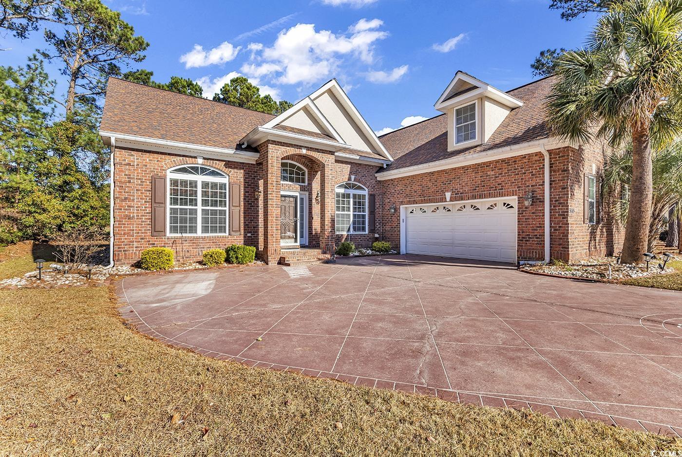 View of front facade featuring a garage