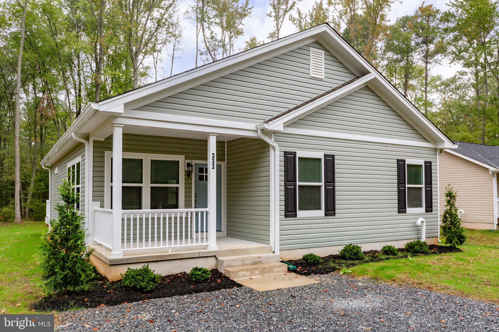 a view of a house with a yard and plants