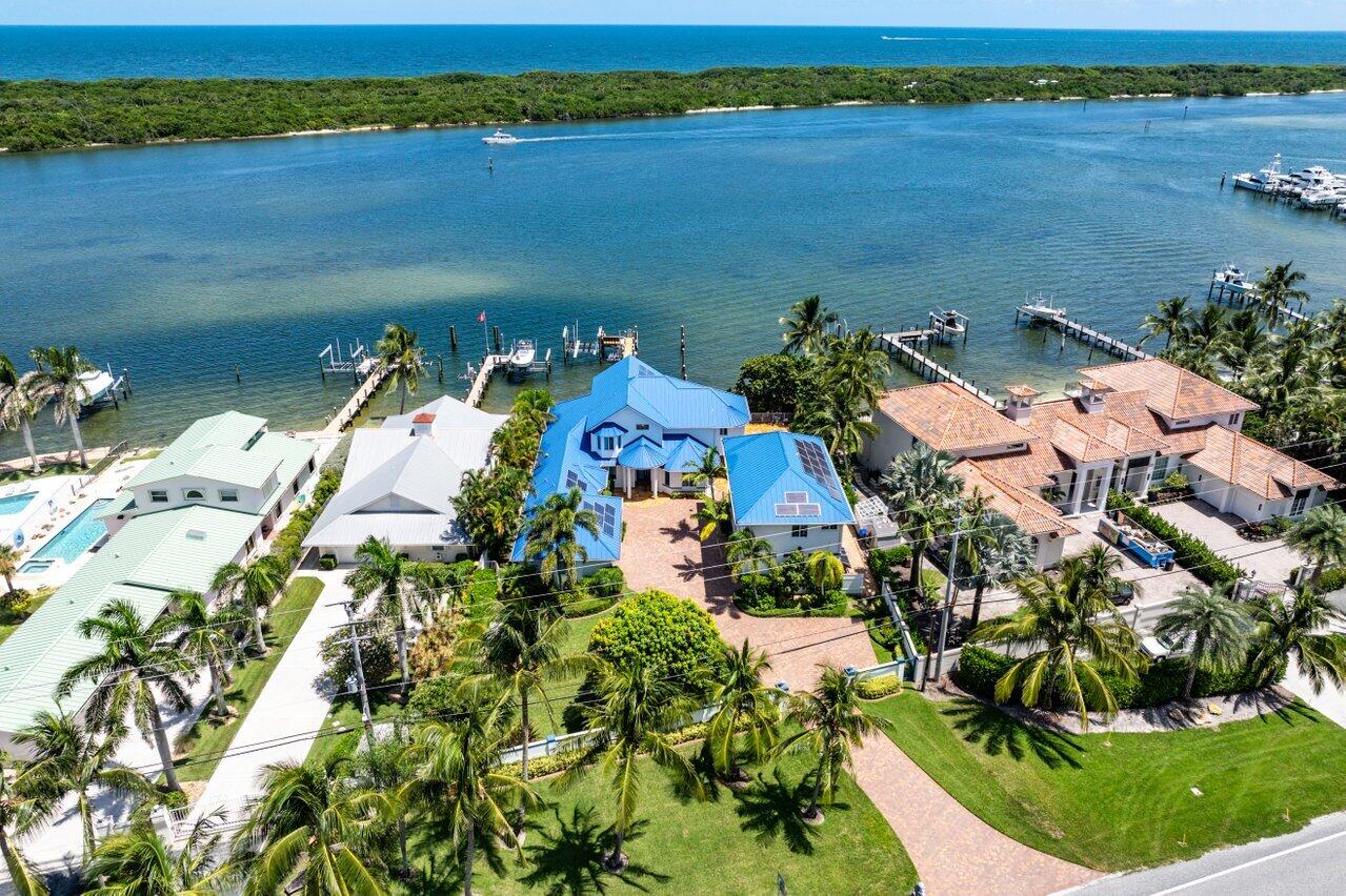 an aerial view of a house with a lake view