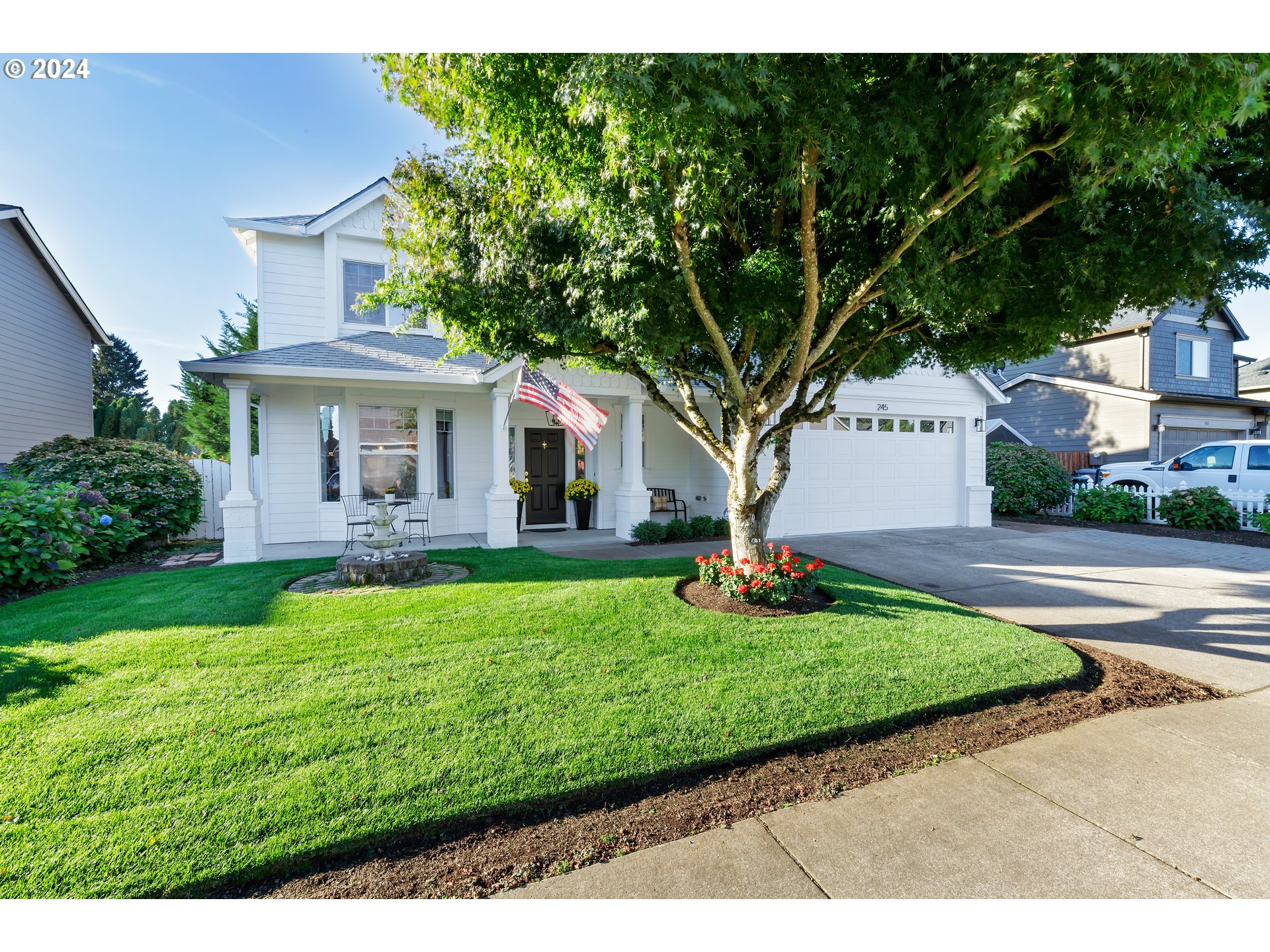 a front view of a house with a yard