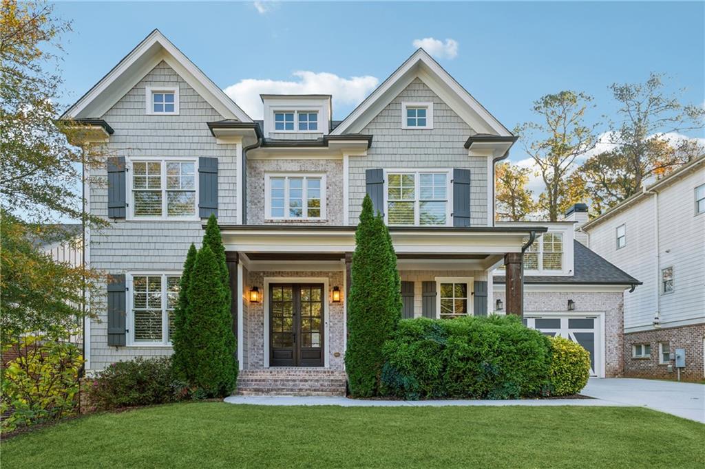 front view of a house with a yard