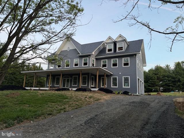 a front view of a residential apartment building with a yard