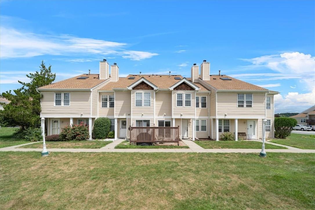 View of front facade featuring a Patio and a front yard