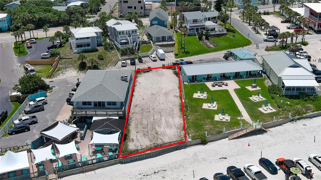 an aerial view of multiple houses with yard