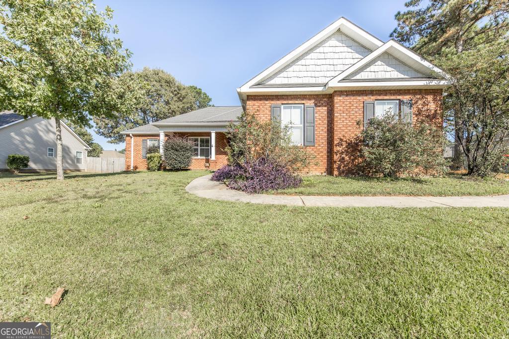 a front view of a house with a yard