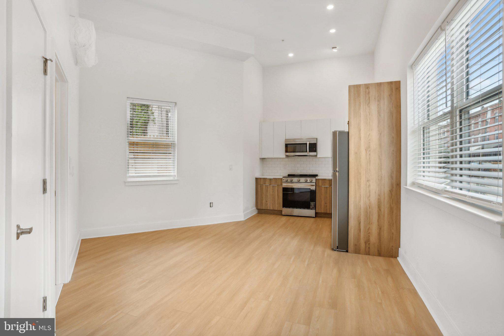 a big room with closet and windows