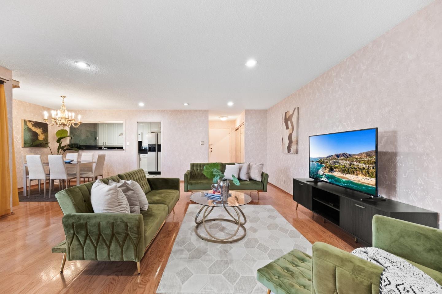 a living room with furniture and a flat screen tv