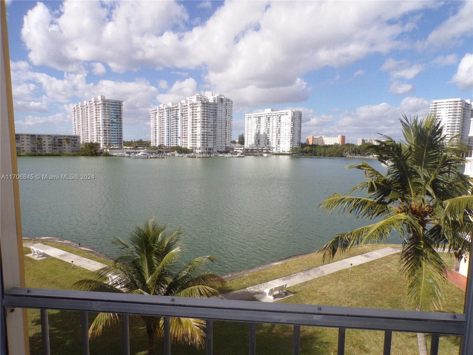 a view of a lake with a city