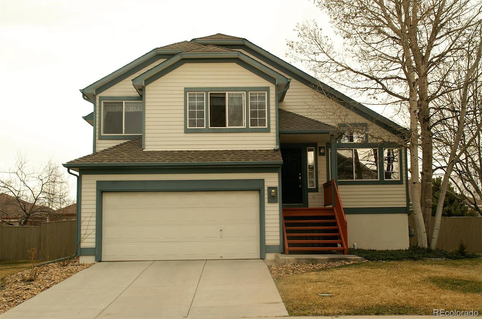 a front view of a house with a garage