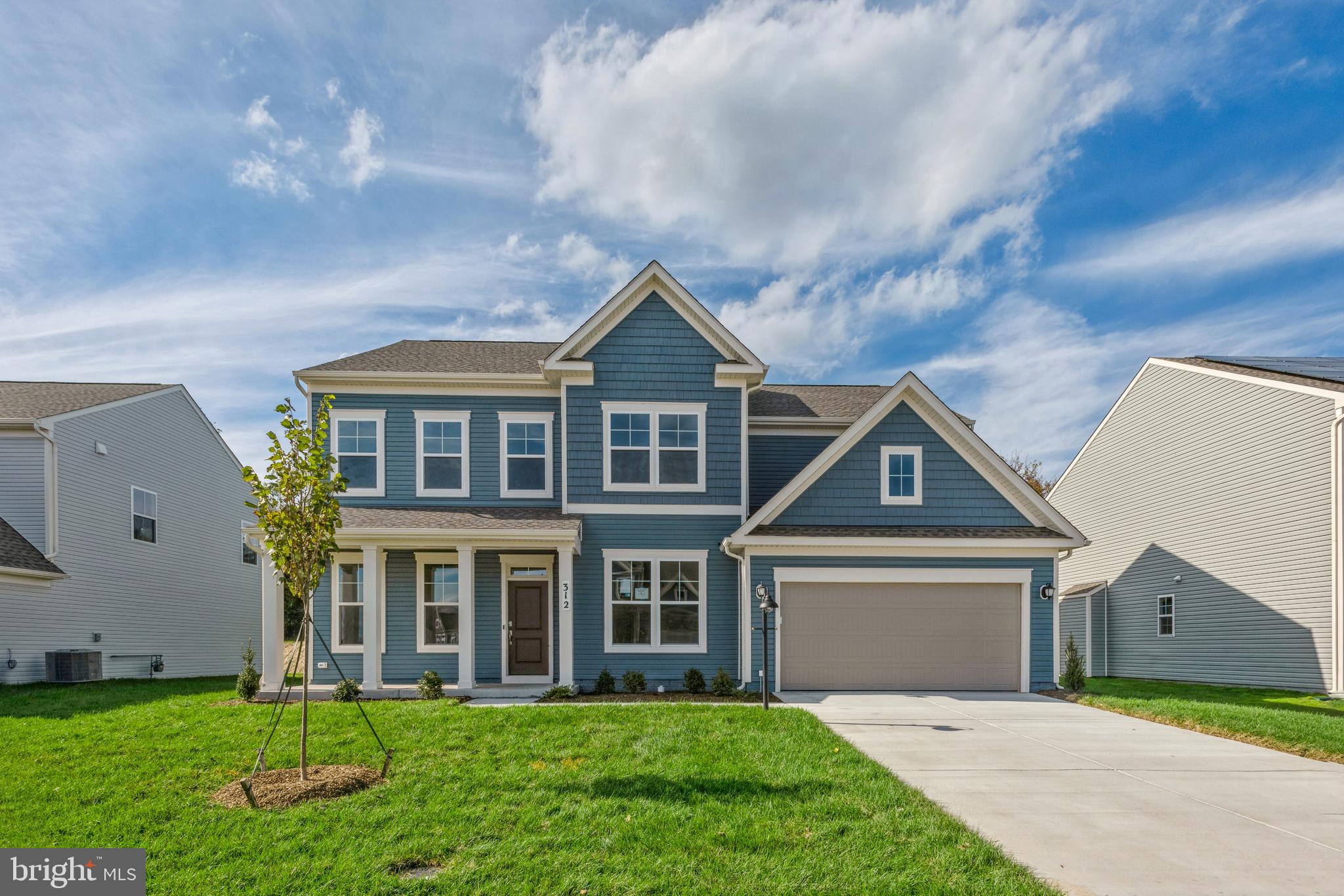 front view of a house with a yard