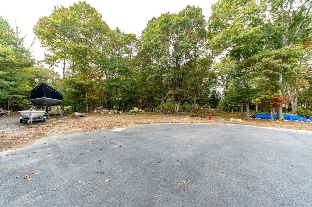 a view of backyard with swimming pool