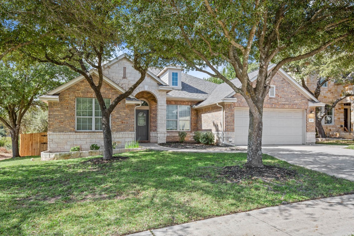 a house that has a tree in front of a house