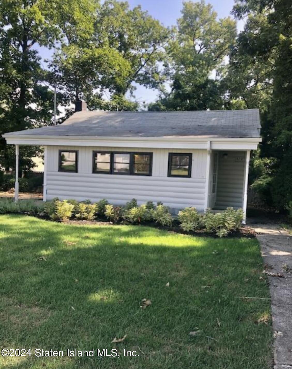 a brick house with a yard