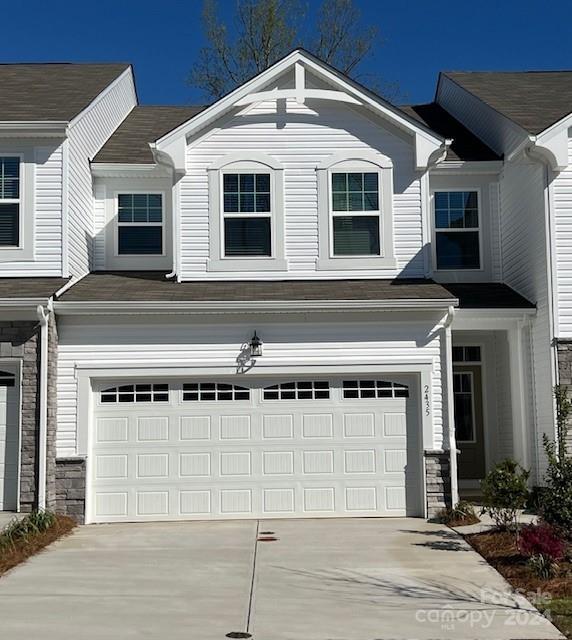 a front view of a house with a garage