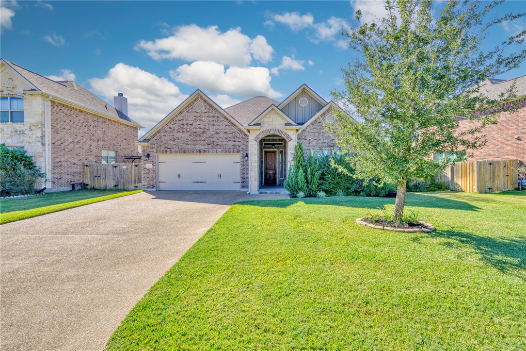 View of front of property with a front yard and a