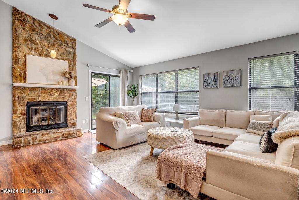 a living room with furniture and a fireplace