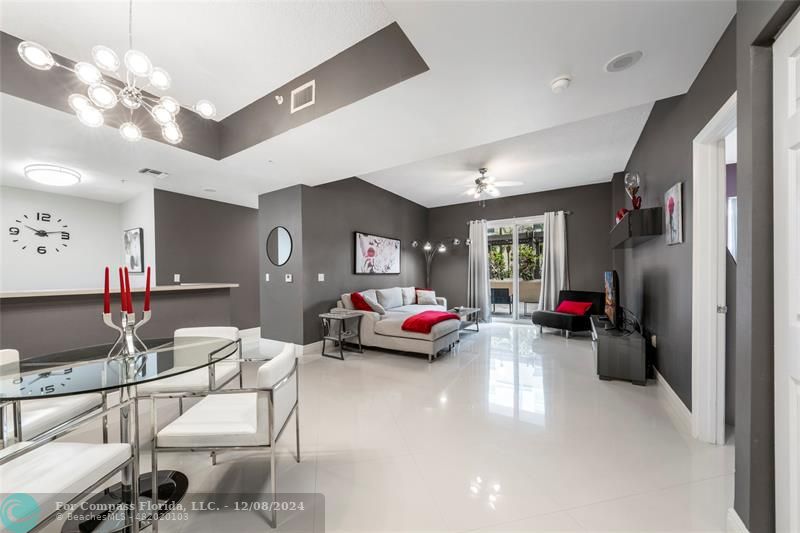 a living room with furniture and a gym